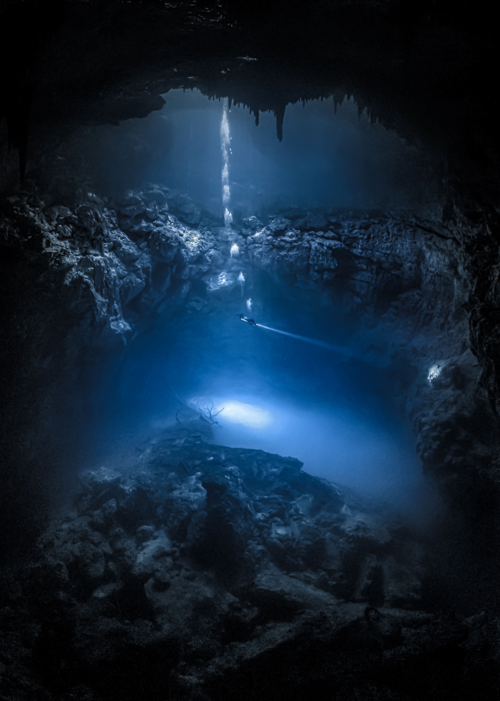 diver goes into a cenote in cancun diver goes into a cenote in cancun